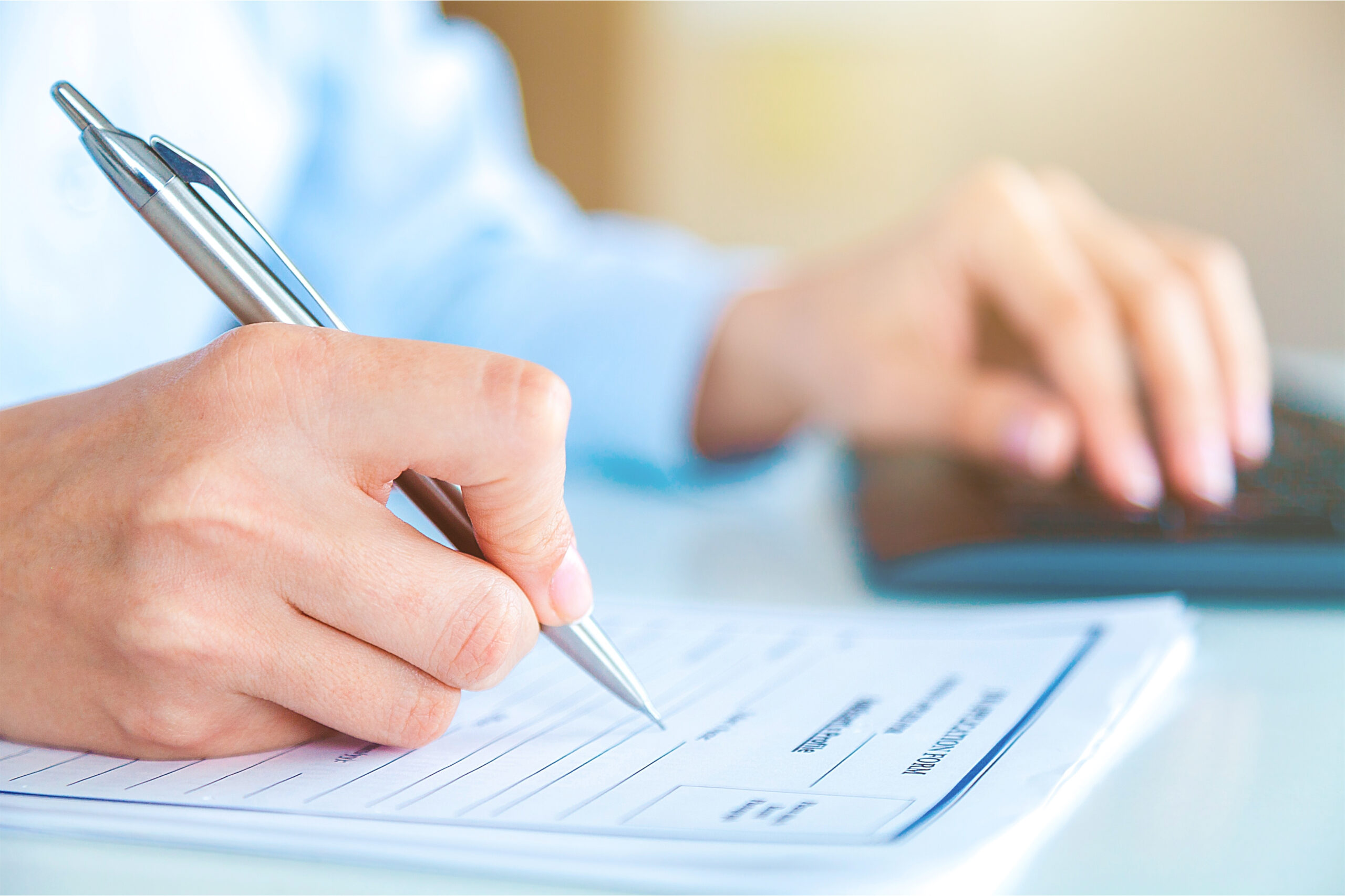 Young man writing college or university funding